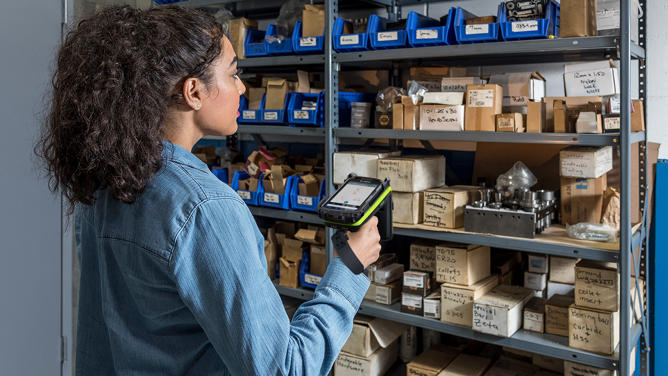 Employee using an RFID reader to track inventory